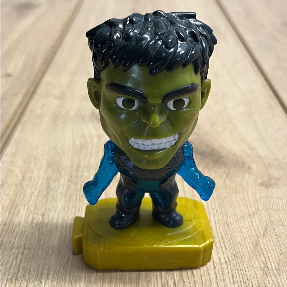 Superhero Action Figure with Green and Blue Accents